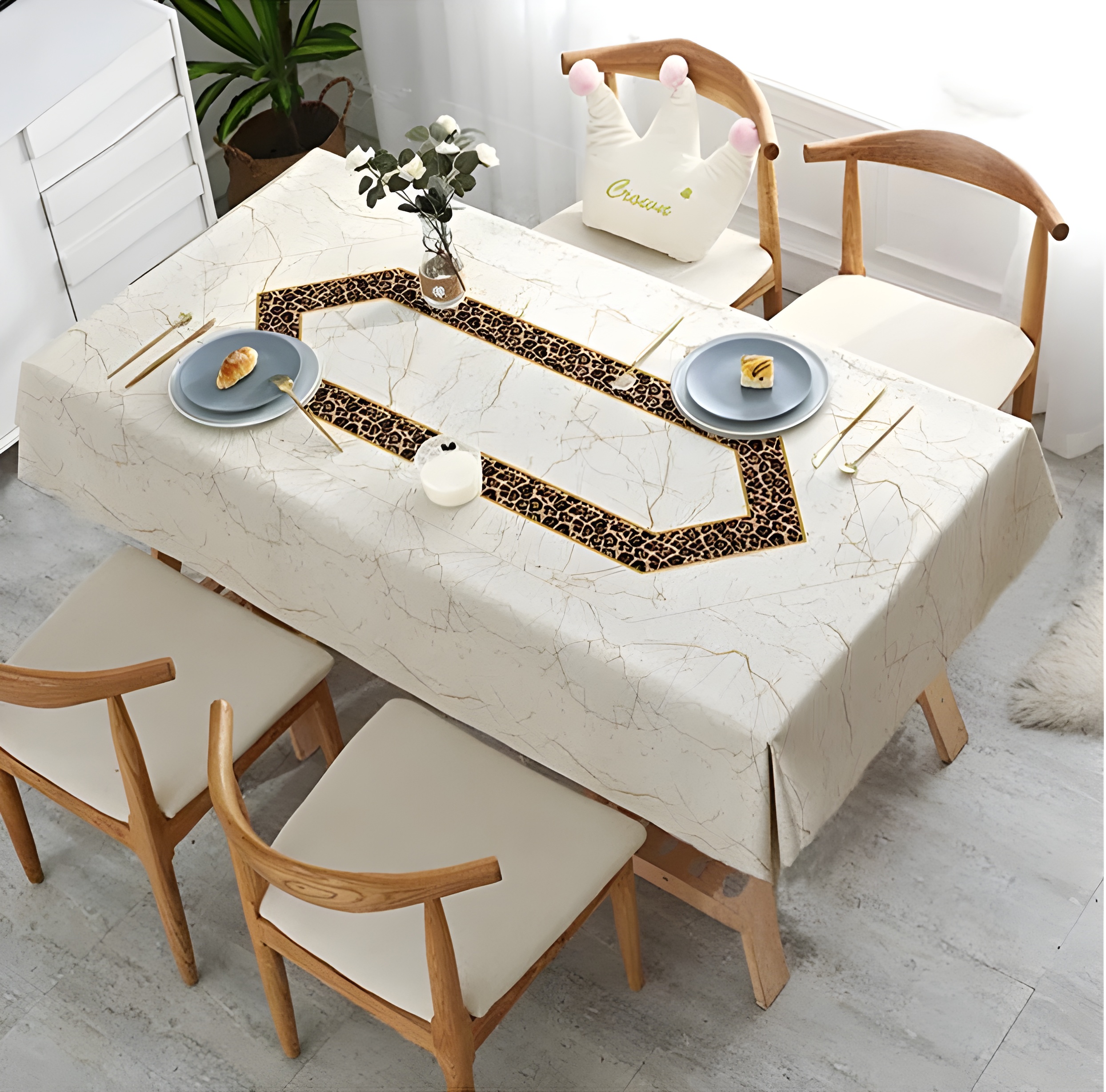 Elegant dining table set with a patterned tablecloth